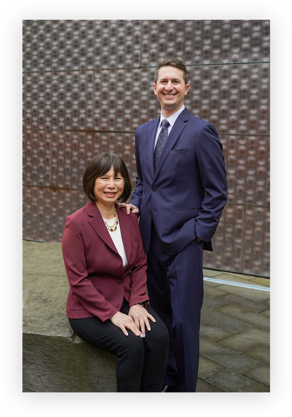 Blake Freeman and Jennifer Chiang posing for a business portrait together.